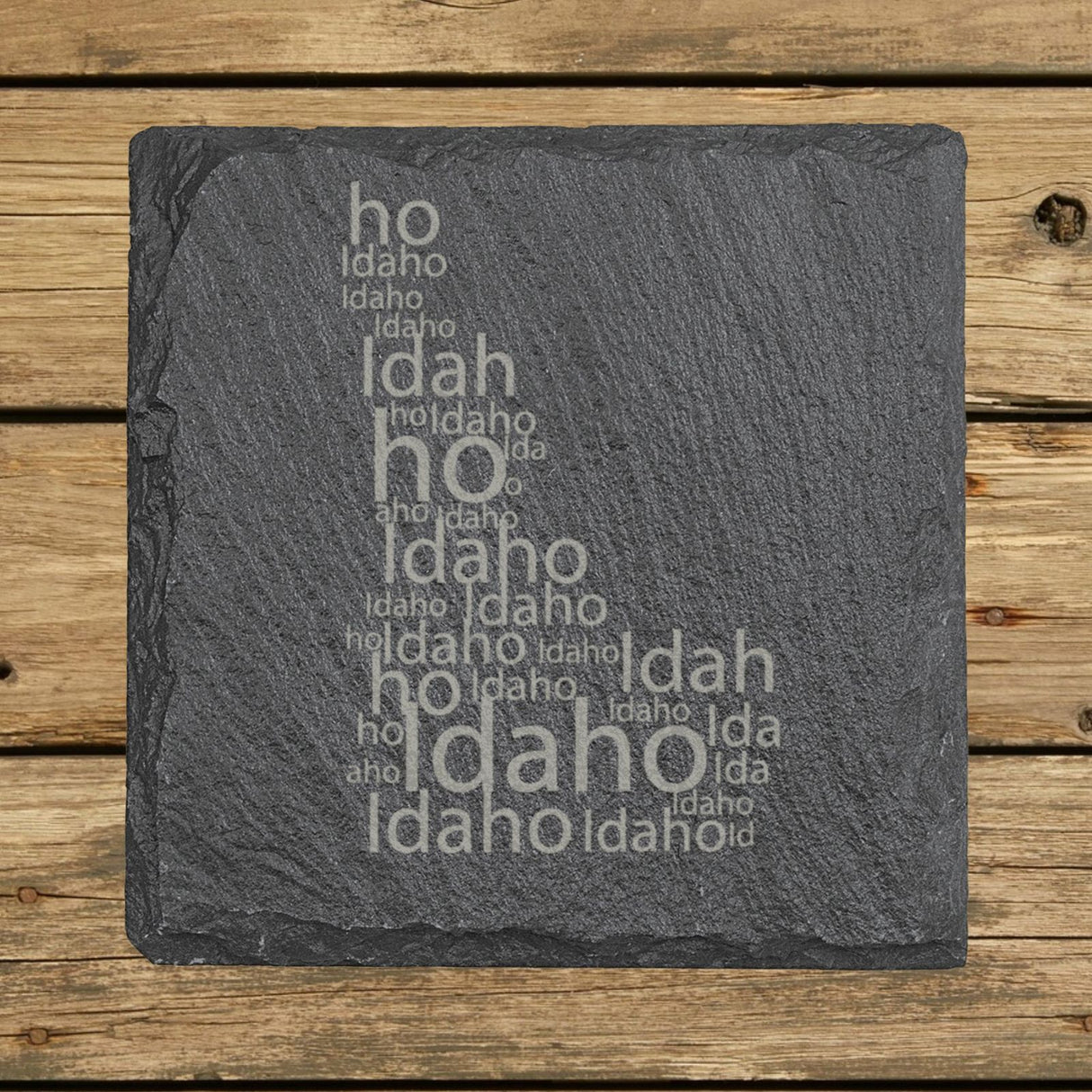 Idaho square slate coaster engraved with a word cloud of repeating Idaho text