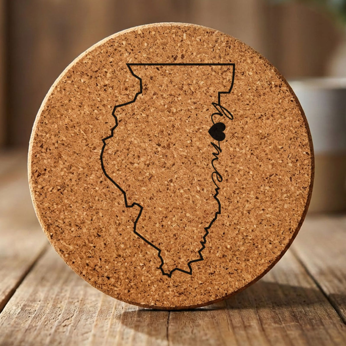 Illinois round cork coaster engraved with the state outline and home in script with a heart