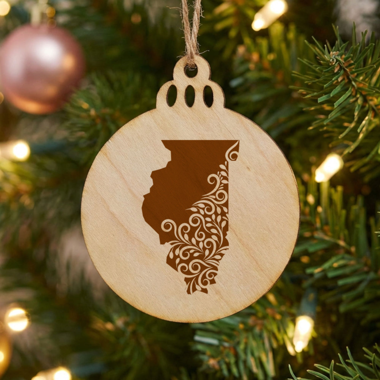 Illinois round wood Christmas ornament engraved with the state shape in ornate floral scrollwork
