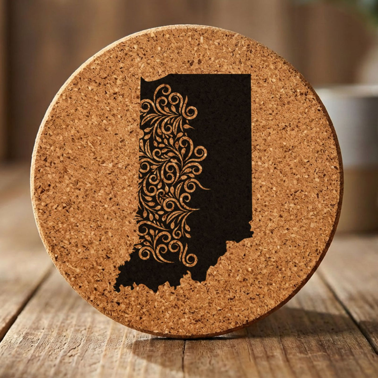 Indiana round cork coaster engraved with the state shape in ornate floral scrollwork