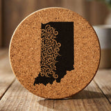 Indiana round cork coaster engraved with the state shape in ornate floral scrollwork