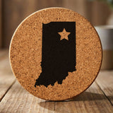 Indiana round cork coaster engraved with the state shape and a star