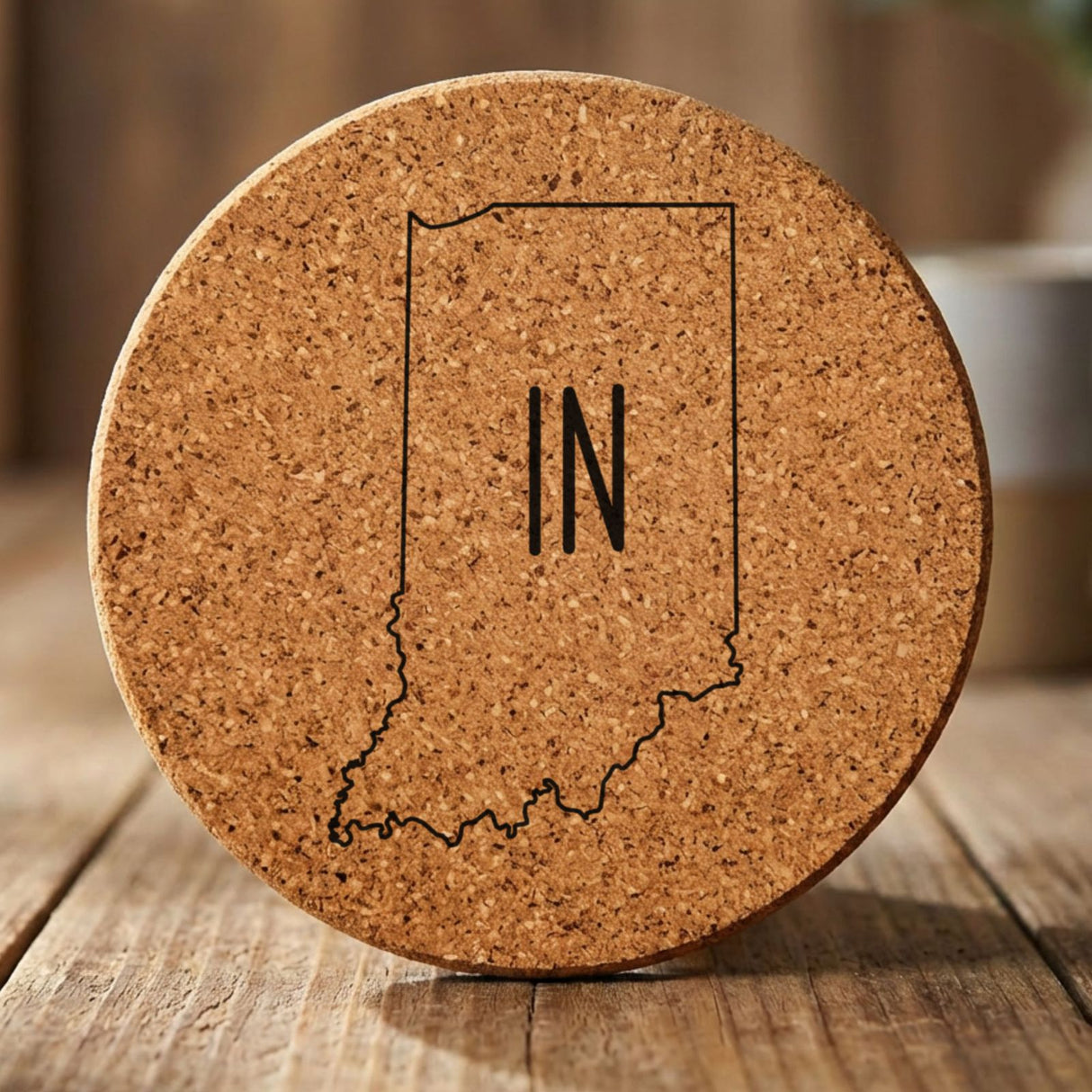 Indiana round cork coaster engraved with the state outline and IN initials