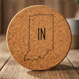 Indiana round cork coaster engraved with the state outline and IN initials