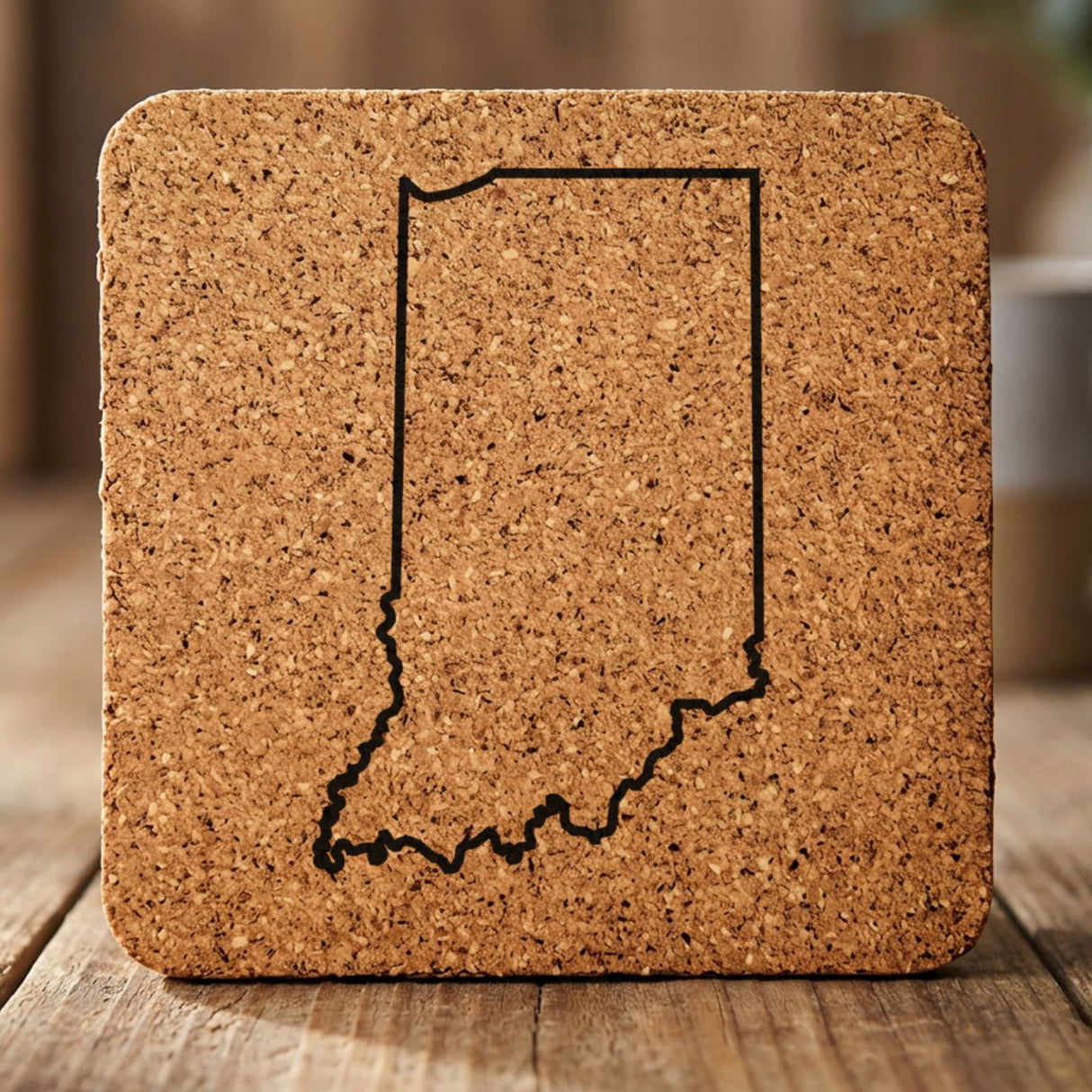 Indiana square cork coaster engraved with a clean state outline