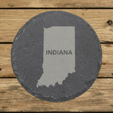 Indiana round slate coaster engraved with the state shape and INDIANA in bold lettering