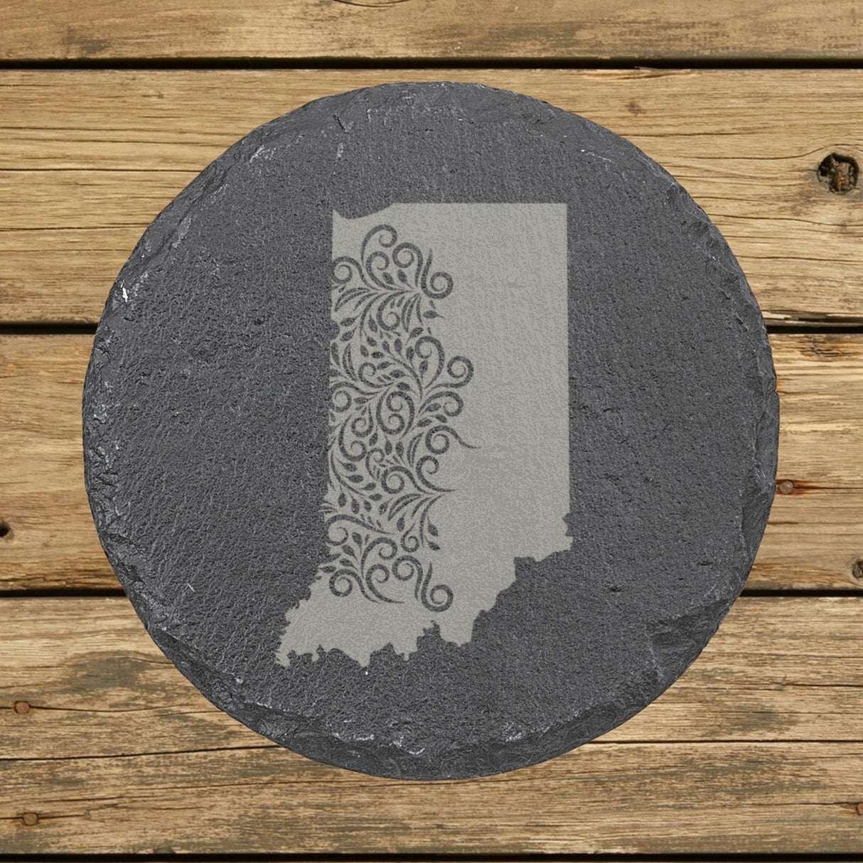 Indiana round slate coaster engraved with the state shape in ornate floral scrollwork