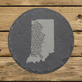 Indiana round slate coaster engraved with the state shape in ornate floral scrollwork