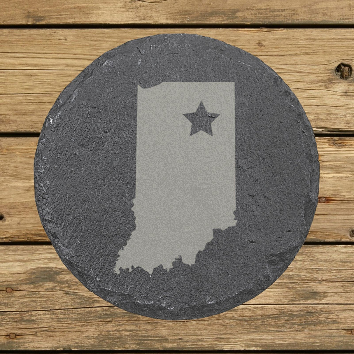 Indiana round slate coaster engraved with the state shape and a star