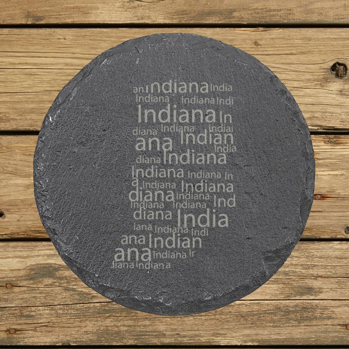 Indiana round slate coaster engraved with a word cloud of repeating Indiana text