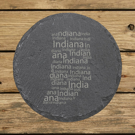 Indiana round slate coaster engraved with a word cloud of repeating Indiana text
