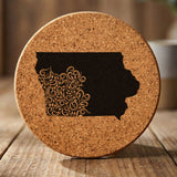 Iowa round cork coaster engraved with the state shape in ornate floral scrollwork