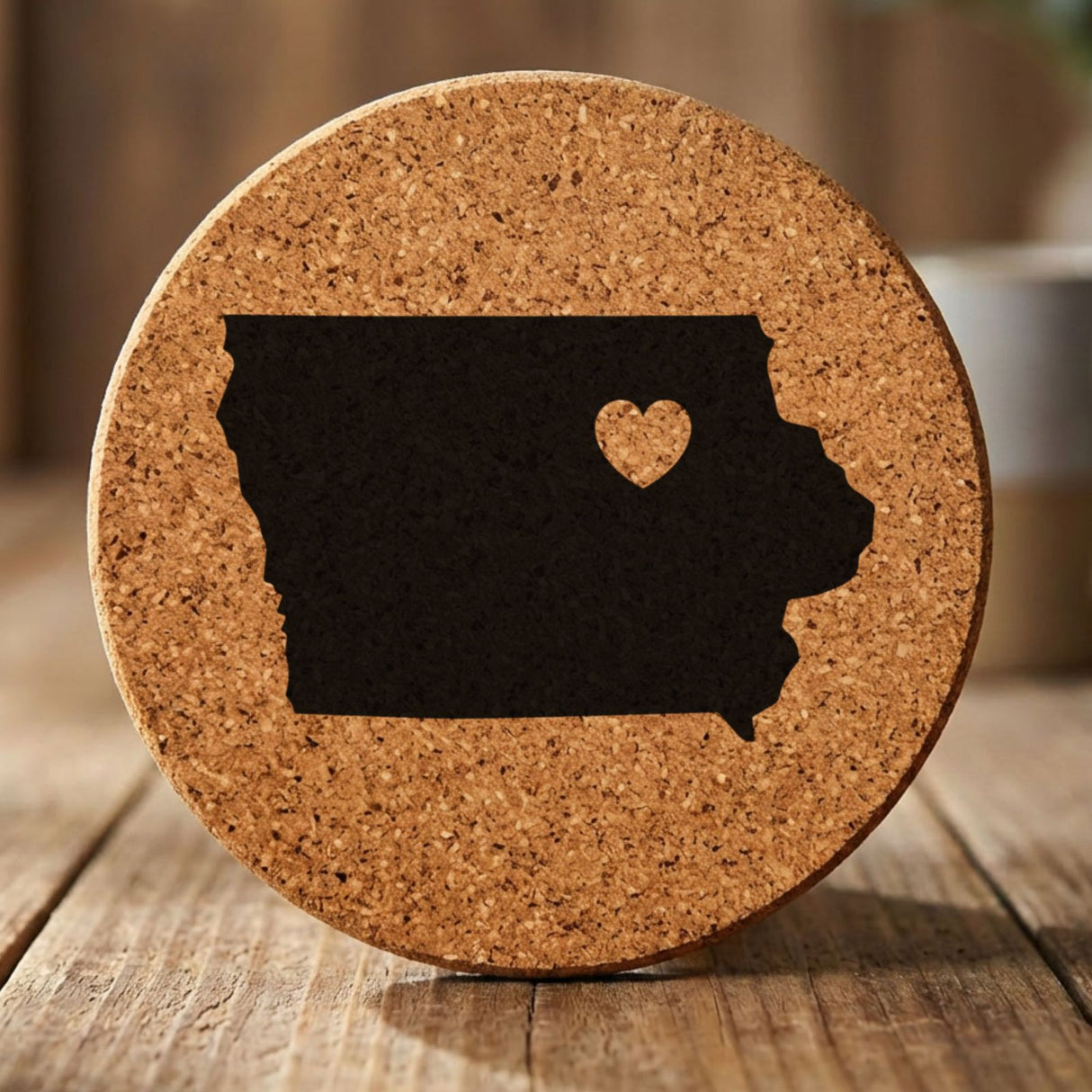 Iowa round cork coaster engraved with the state shape and a heart