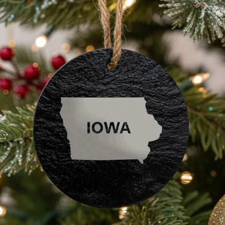 Iowa round slate Christmas ornament engraved with the state shape and IOWA in bold lettering
