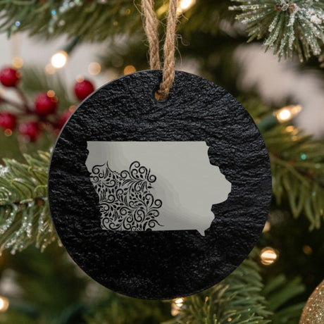 Iowa round slate Christmas ornament engraved with the state shape in ornate floral scrollwork