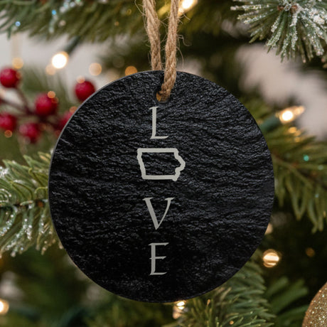Iowa round slate Christmas ornament engraved with LOVE stacked vertically using the state as the letter O