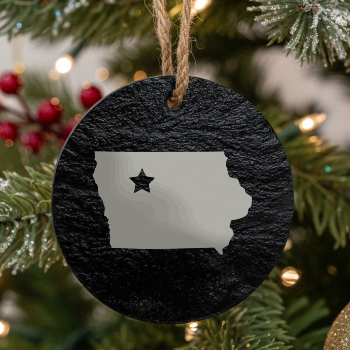 Iowa round slate Christmas ornament engraved with the state shape and a star