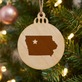 Iowa round wood Christmas ornament engraved with the state shape and a star