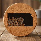 Kansas round cork coaster engraved with the state shape in ornate floral scrollwork