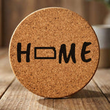 Kansas round cork coaster engraved with HOME using the state outline as the letter O