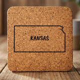 Kansas square cork coaster engraved with the state outline and KANSAS in hand-drawn brush lettering
