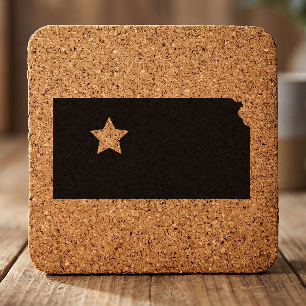 Kansas square cork coaster engraved with the state shape and a star