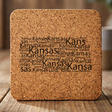 Kansas square cork coaster engraved with a word cloud of repeating Kansas text