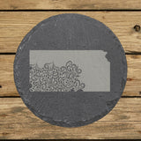 Kansas round slate coaster engraved with the state shape in ornate floral scrollwork