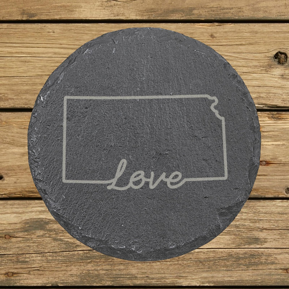 Kansas round slate coaster engraved with a hand-drawn state outline and love in cursive