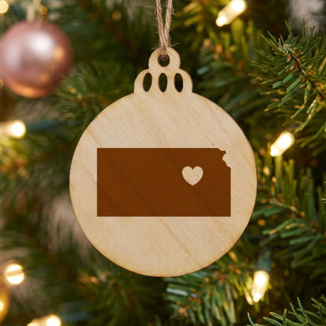 Kansas round wood Christmas ornament engraved with the state shape and a heart