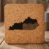 Kentucky square cork coaster engraved with the state shape in ornate floral scrollwork