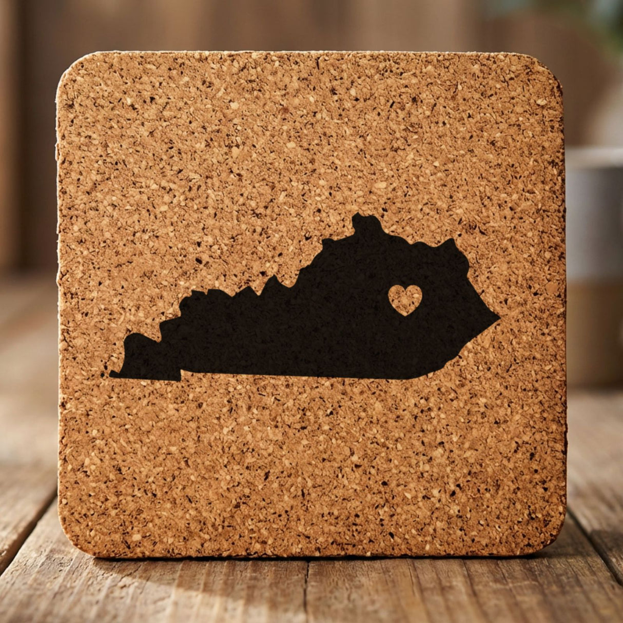 Kentucky square cork coaster engraved with the state shape and a heart