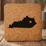 Kentucky square cork coaster engraved with the state shape and a star