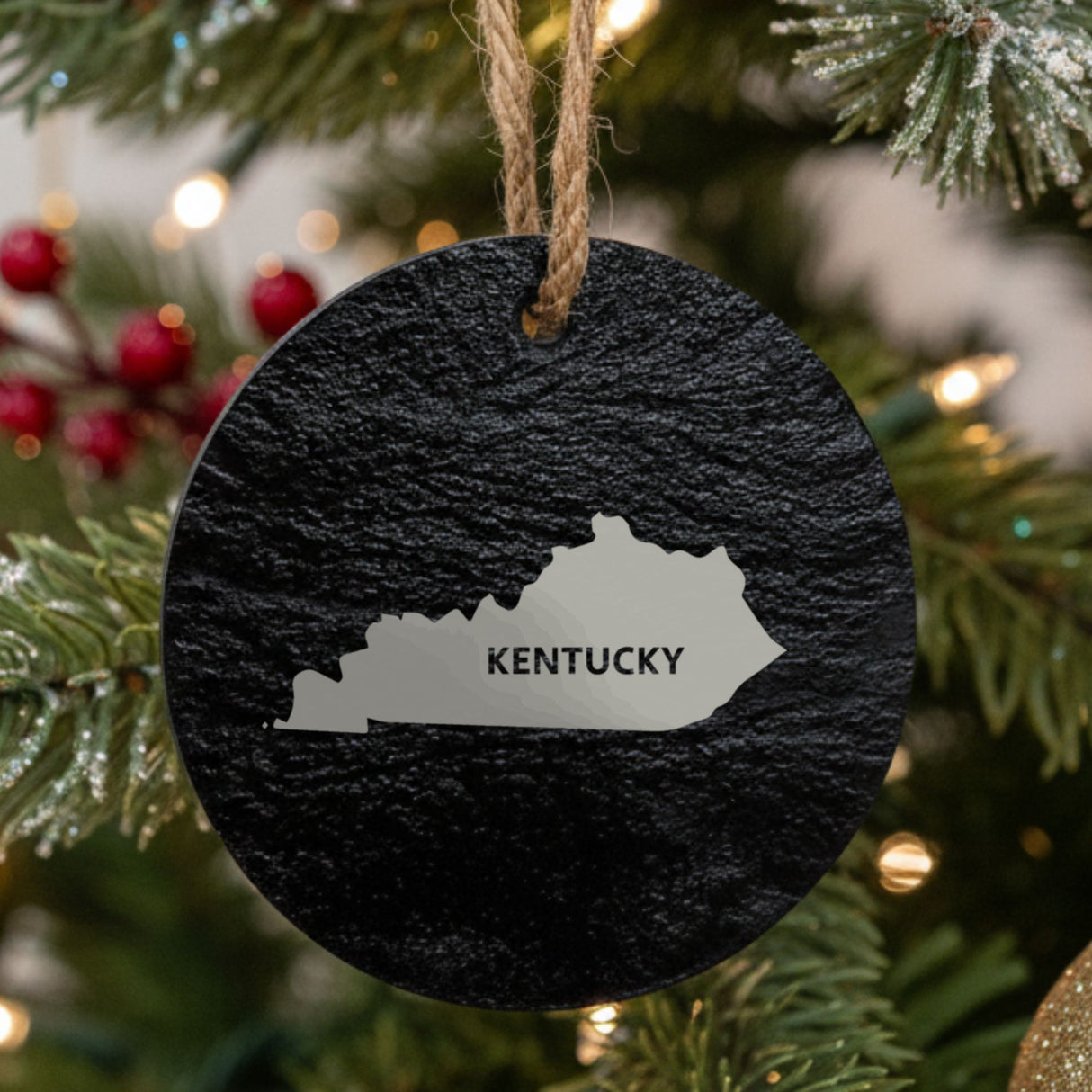 Kentucky round slate Christmas ornament engraved with the state shape and KENTUCKY in bold lettering