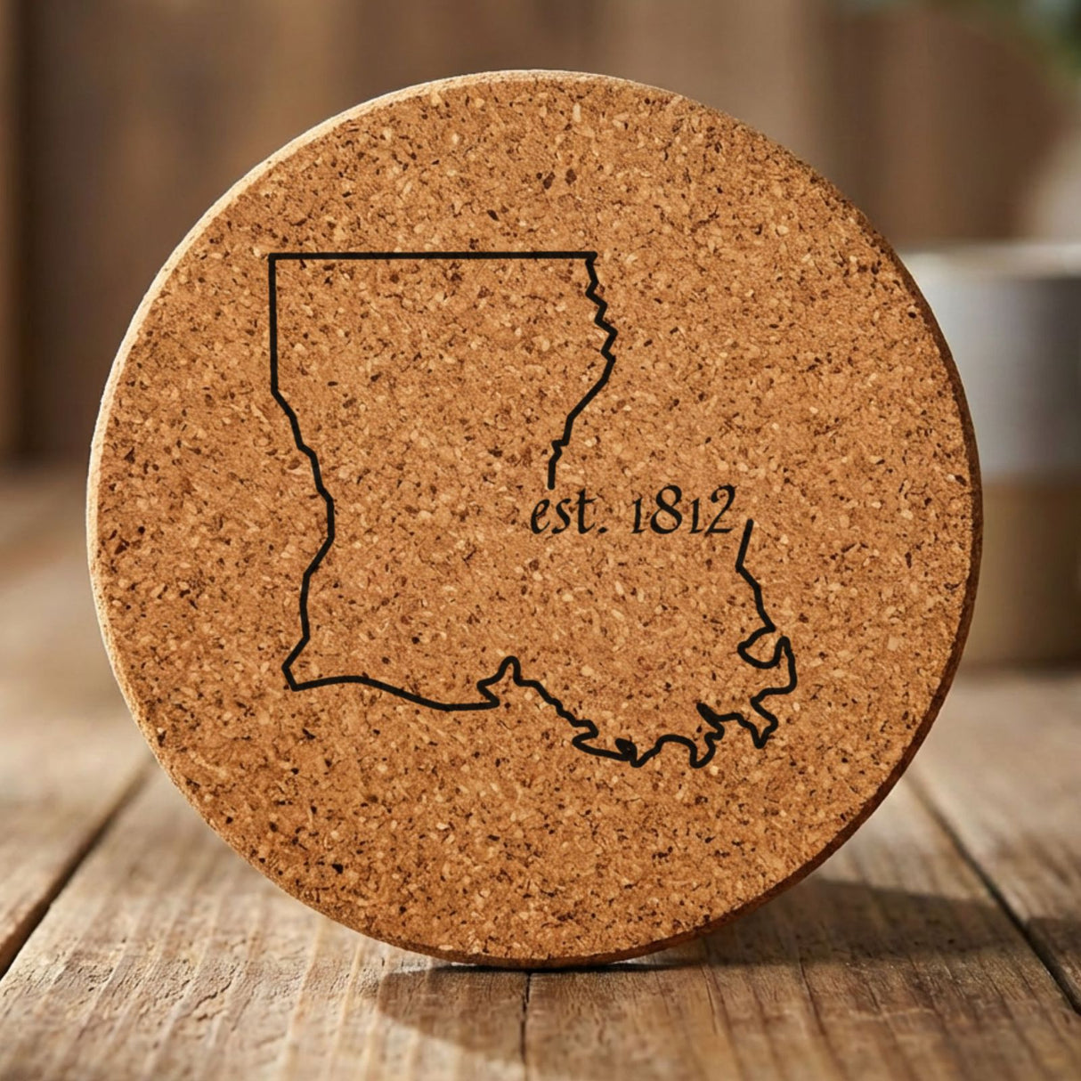 Louisiana round cork coaster engraved with the state outline and est. 1812