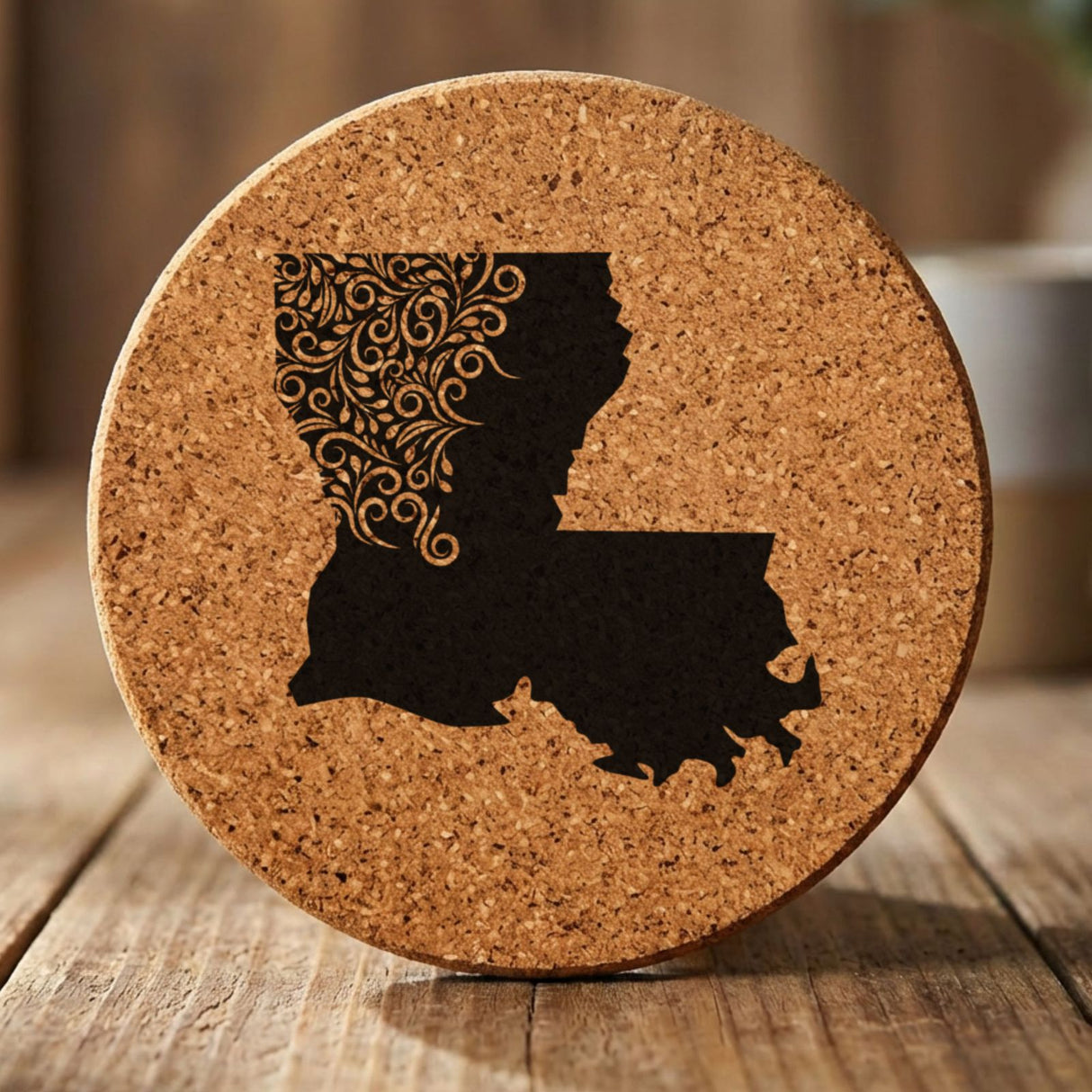 Louisiana round cork coaster engraved with the state shape in ornate floral scrollwork