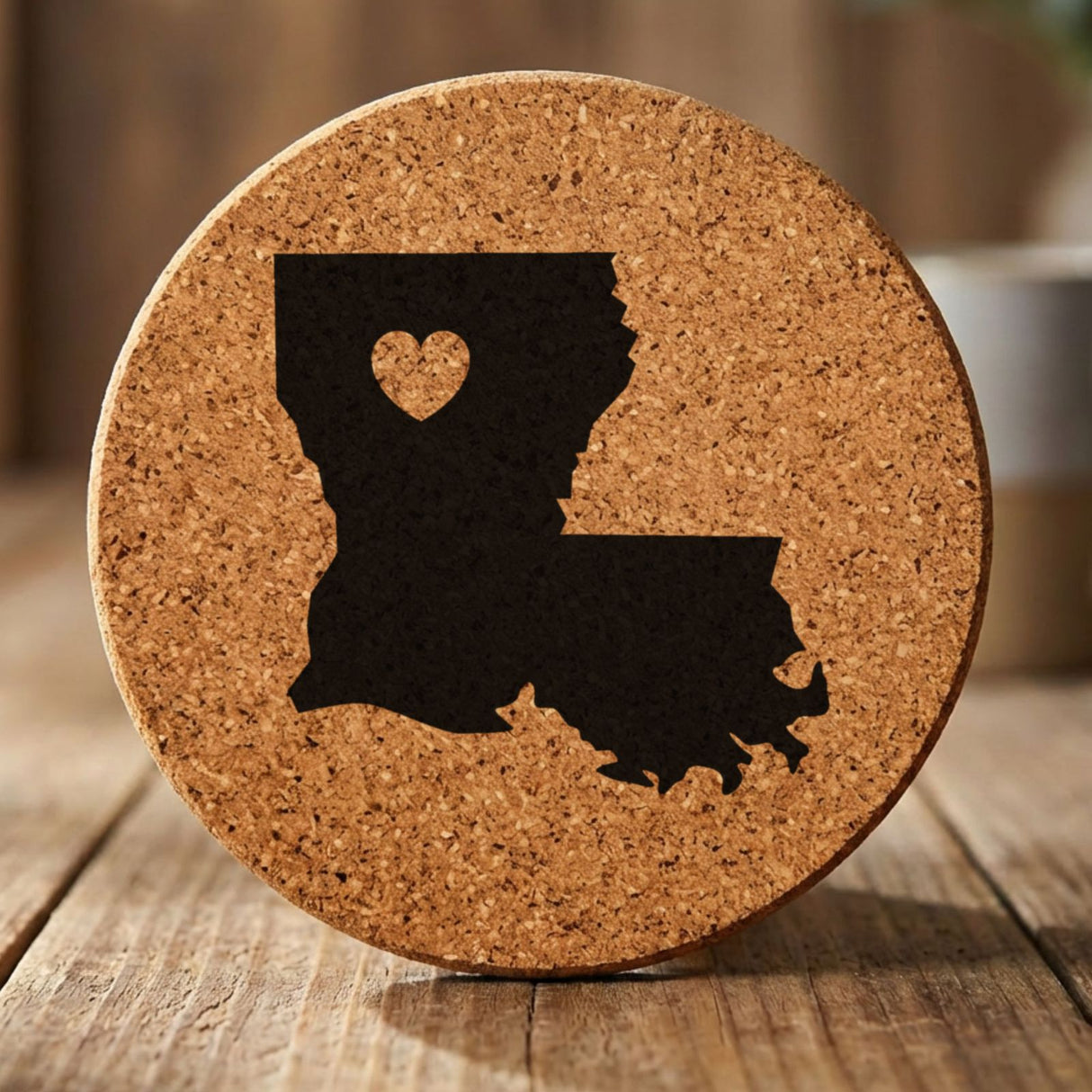 Louisiana round cork coaster engraved with the state shape and a heart