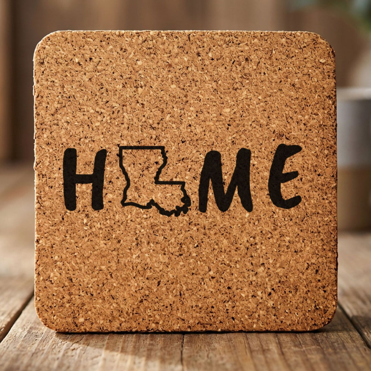 Louisiana square cork coaster engraved with HOME using the state outline as the letter O