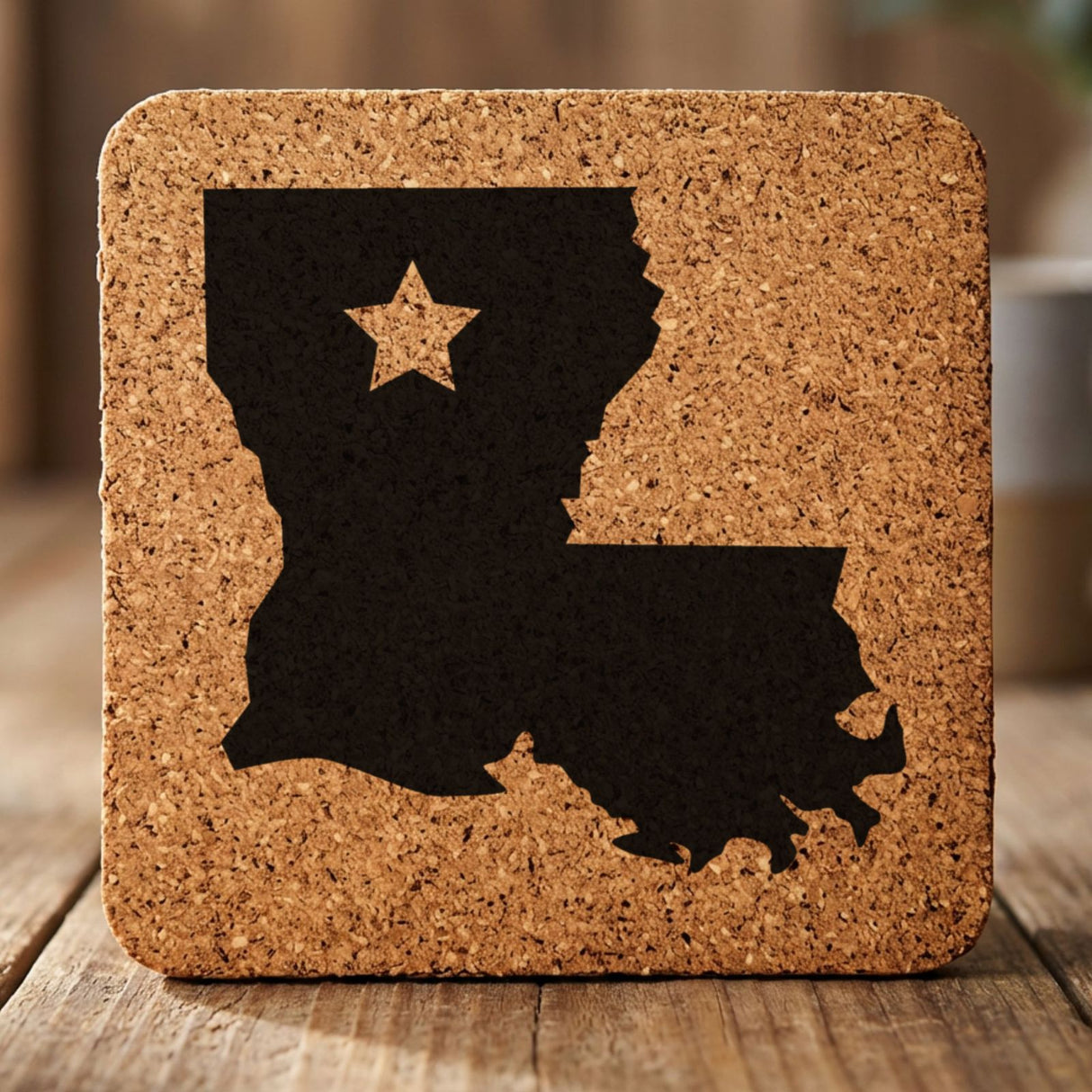Louisiana square cork coaster engraved with the state shape and a star