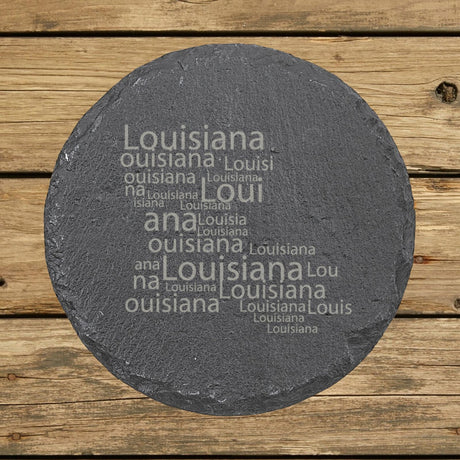Louisiana round slate coaster engraved with a word cloud of repeating Louisiana text