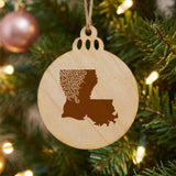 Louisiana round wood Christmas ornament engraved with the state shape in ornate floral scrollwork