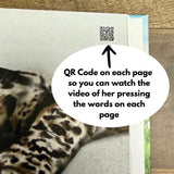 A children's book page with a QR code visible near the top