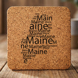 Maine square cork coaster engraved with a word cloud of repeating Maine text