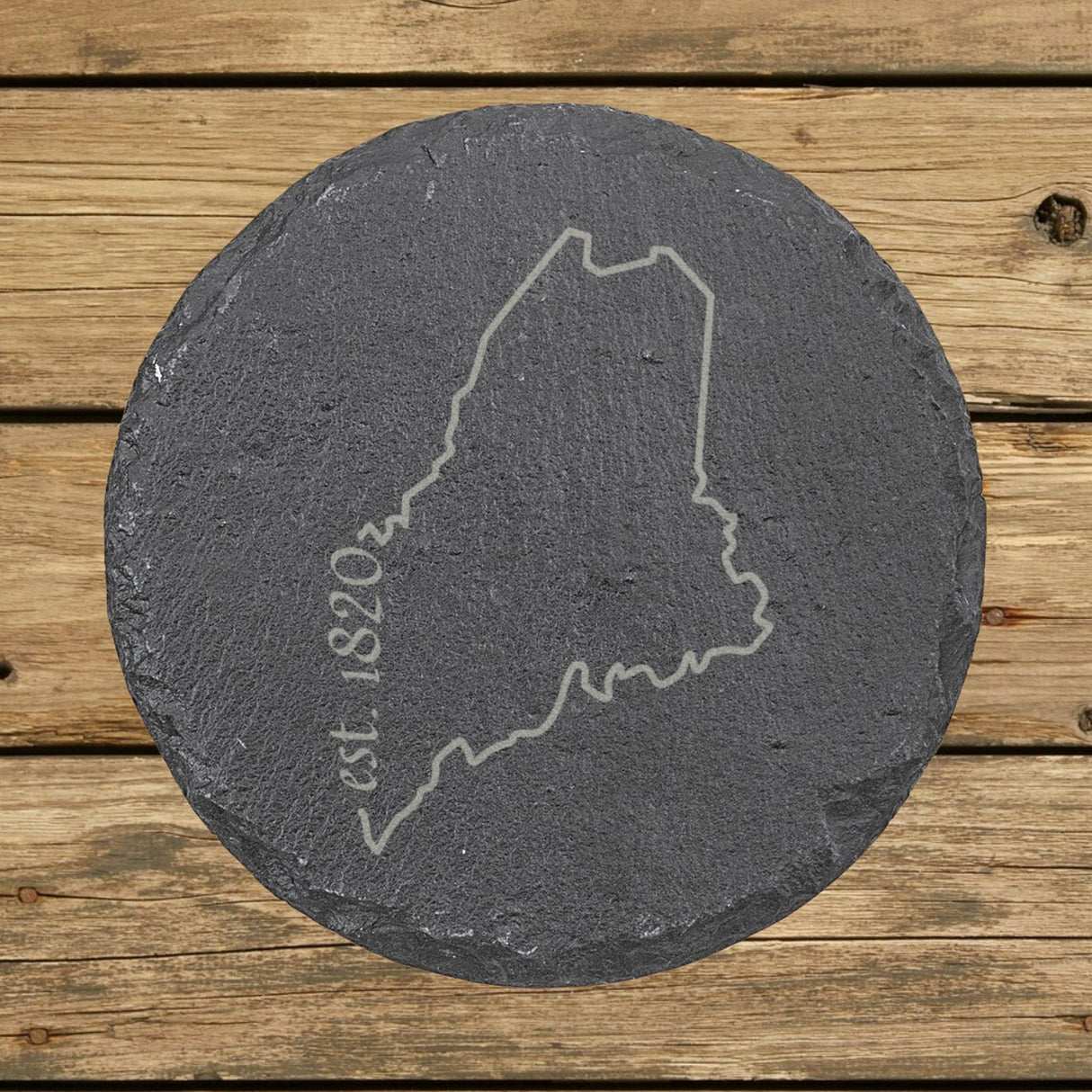 Maine round slate coaster engraved with the state outline and est. 1820