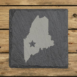 Maine square slate coaster engraved with the state shape and a star