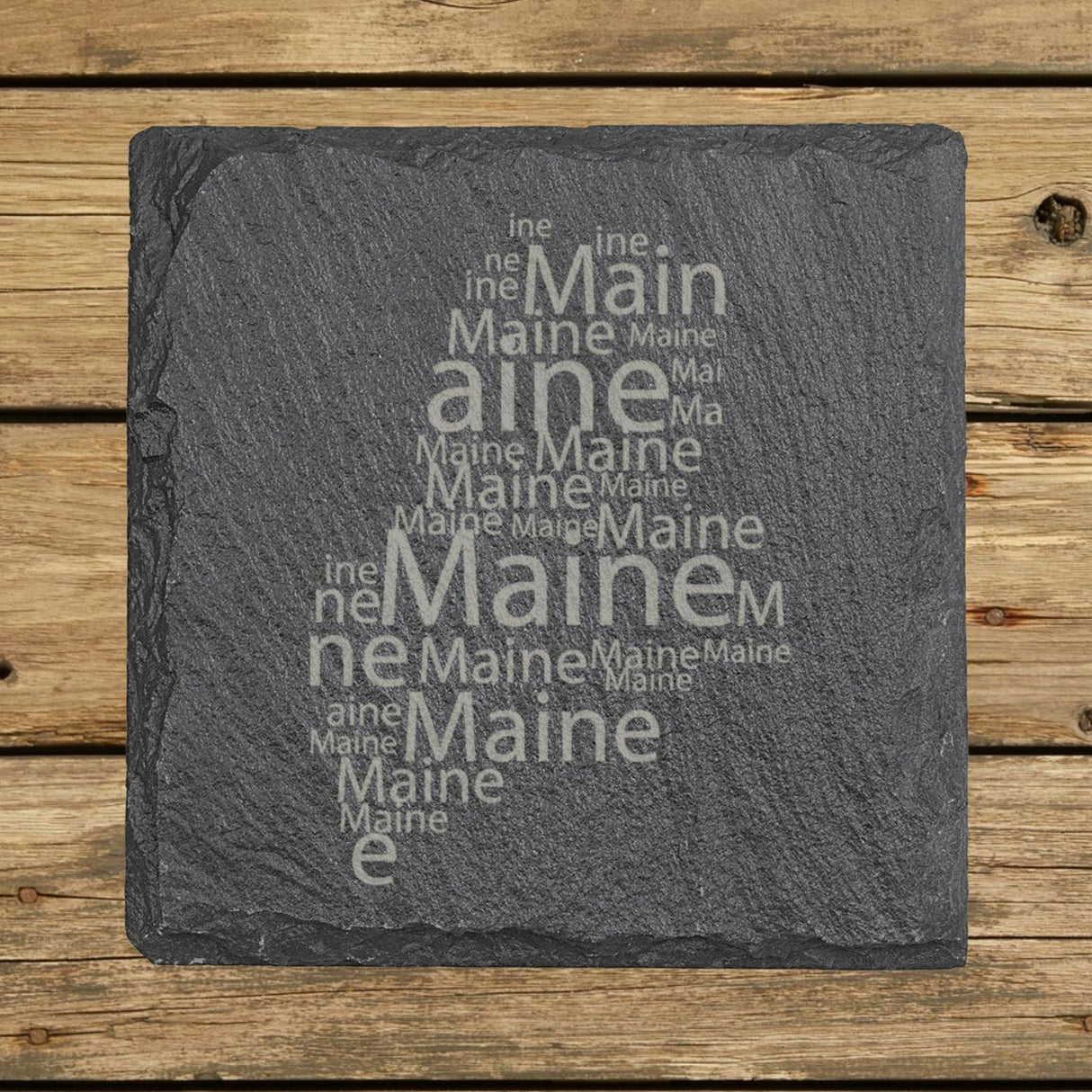 Maine square slate coaster engraved with a word cloud of repeating Maine text