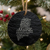 Maine round slate Christmas ornament engraved with a word cloud of repeating Maine text