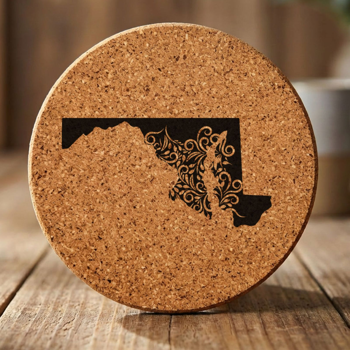 Maryland round cork coaster engraved with the state shape in ornate floral scrollwork
