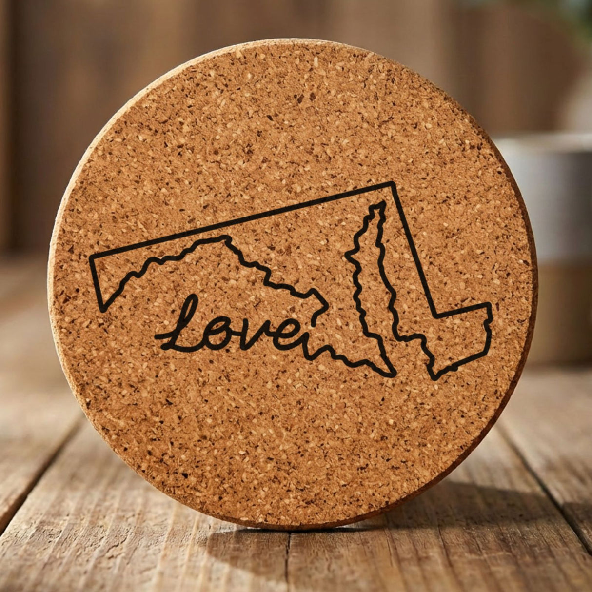 Maryland round cork coaster engraved with a hand-drawn state outline and love in cursive