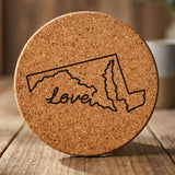 Maryland round cork coaster engraved with a hand-drawn state outline and love in cursive